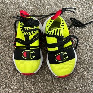 Champions kids shoes. Size 5T . Never worn